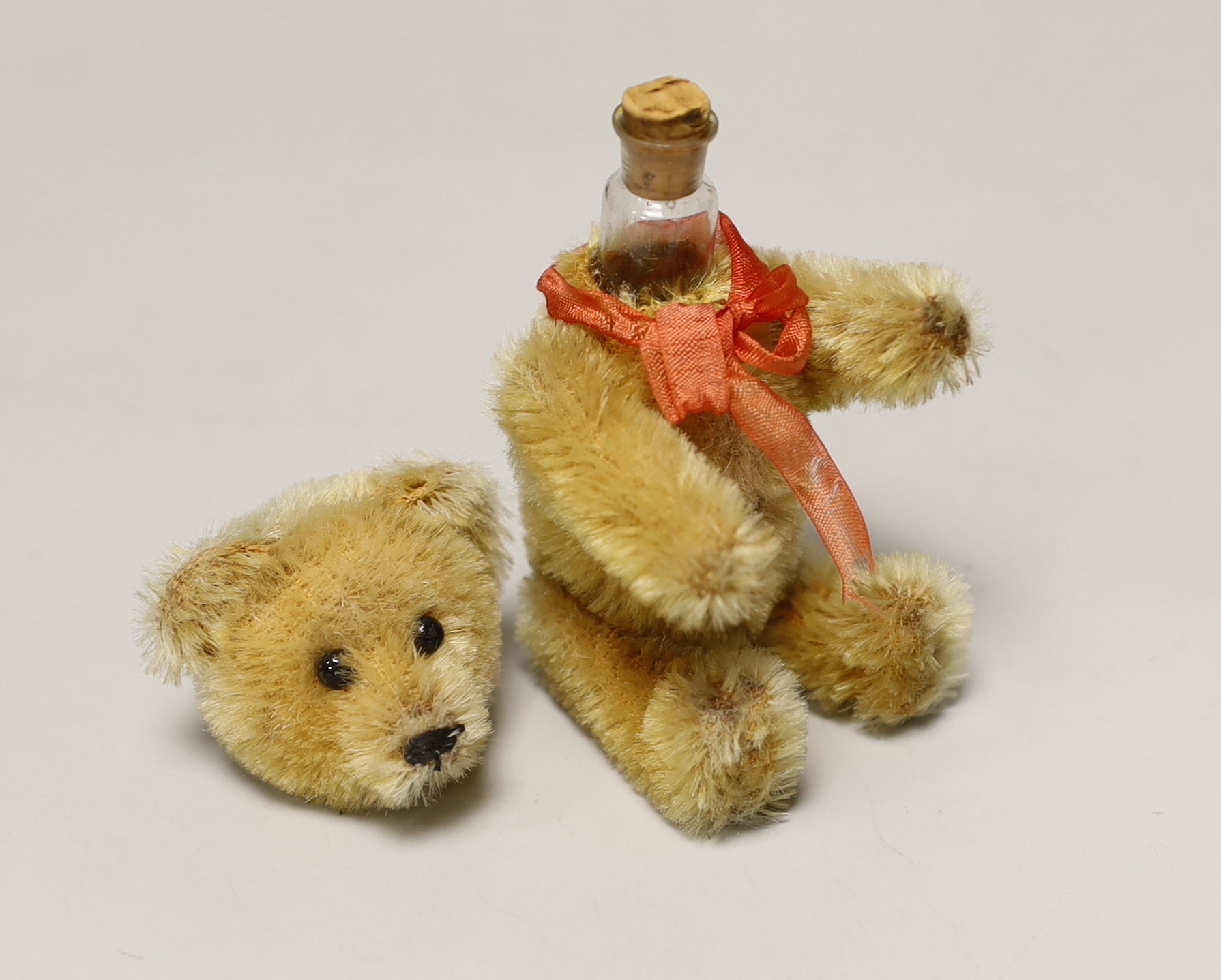 A Schuco perfume bear, 1950's, 5in., excellent condition, bottle complete